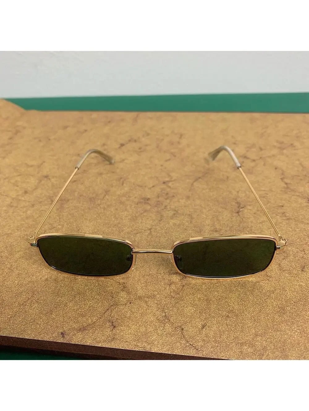 Y2k 2000s vintage green and gold unique slim style sunglasses. Gold trim with
